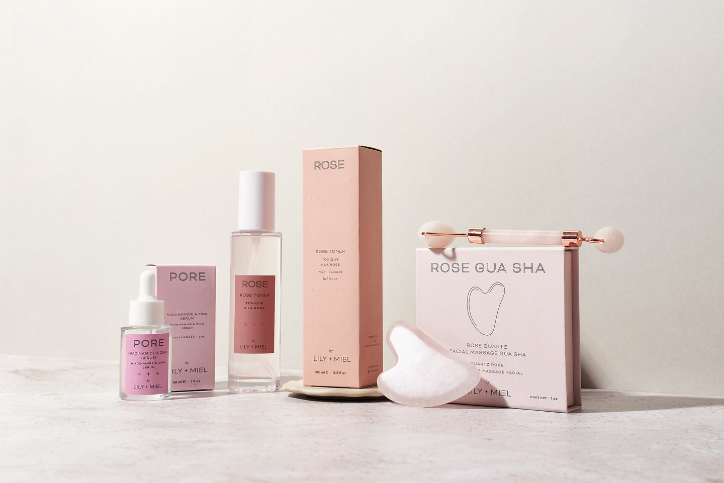 skincare products. rose toner. gua sha. skincare gift sets. gifts for women. gifts for teenagers. facial massage roller. niacinamide serum. Christmas gifts. birthday gift sets. facial toning. tone face. presents for her. pink gifts.